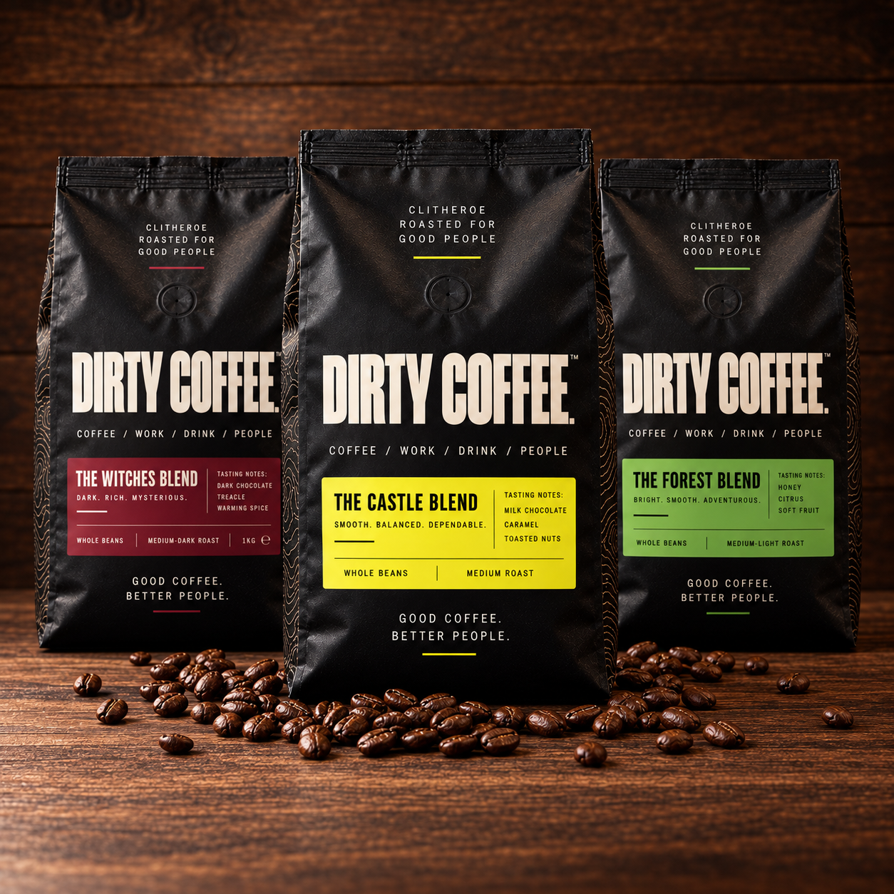 Three Dirty Coffee bags: Witches, Castle and Forest blends on dark walnut.